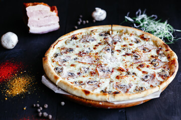 Thin pizza with mushrooms on the table