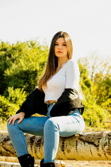 autumn portrait of attractive brunette in the park outdoor