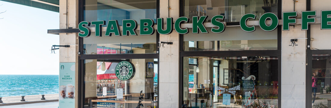 Thessaloniki, Greece - Martch 21, 2020: Facade of empty Starbucks Cafe. Starbucks Corporation is an American global coffee company and coffeehouse chain.