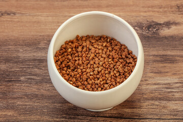 Raw buсkwheat cereal in the bowl