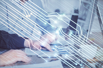 Double exposure of technology hologram with man working on computer background. Concept of big data.