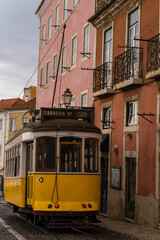 Fototapeta na wymiar Tram stopping on a Lisbon street