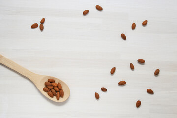 almonds on a light wooden background