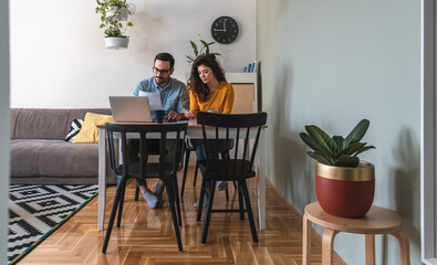 Couple manage finances together at home