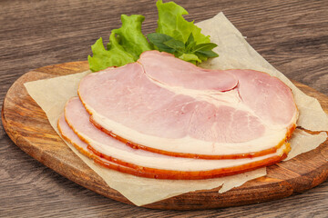 Sliced pork belly over board