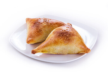 samsa with meat on plate isolated on white background
