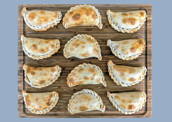 Top view of  delicious baked turnovers, a traditional snack in the gastronomy of Argentina.