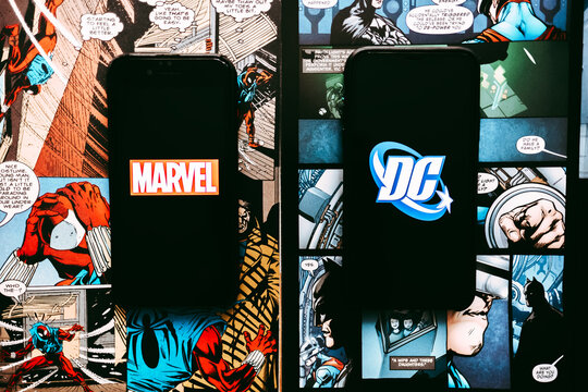 Marvel and DC logo on the comic book page background. Rostov-on-Don, Russia. 12 October 2019