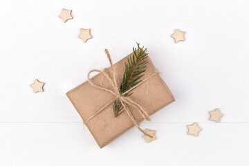 Christmas holidays gift box decorated with fir tree branch.