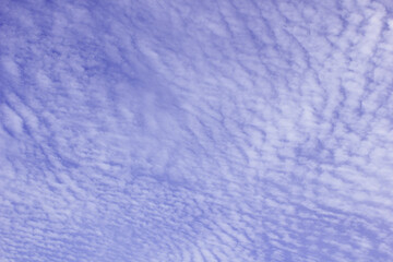 The sky has clouds that look like waves