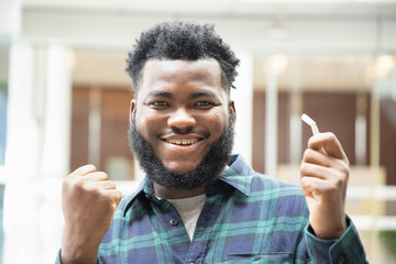 Happy smiling successful African black man  quit smoking, smoking ban concept