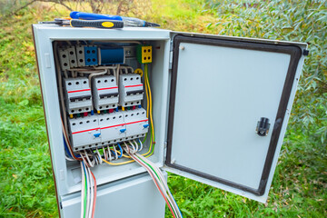 Electric panel on the street. Metal cabinet with electrical switches. Electric cabinet on...