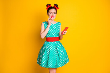 What if i get horrible feedback. Scared girl use smartphone wear teal clothes isolated bright color background