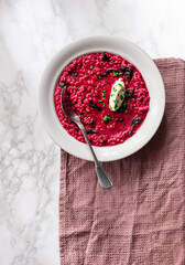 Beet root risotto with dry plums 
