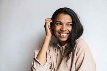 Happy african american woman smiling and looking aside