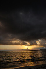 Dark clouds at sunset on the ocean