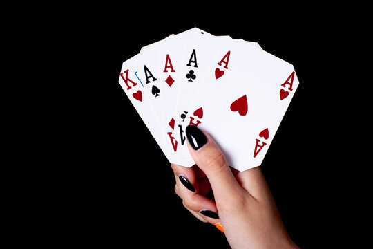 Hand With Aces Cards on black background