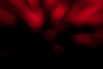 Blurred dark red and black background. Abstract soft explosion effect. Centric motion pattern