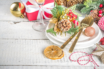Christmas or New Year table setting. Place setting for Christmas Dinner with Xmas Holiday Decorations