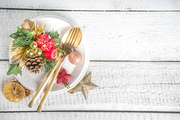 Christmas or New Year table setting. Place setting for Christmas Dinner with Xmas Holiday Decorations