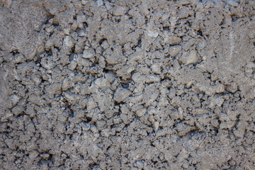 Concrete texture with large and small stones. Background