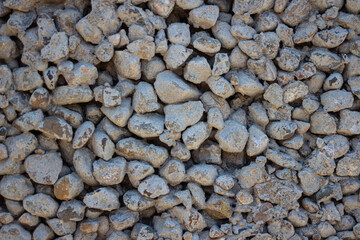 Concrete texture with large and small stones. Background