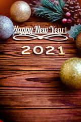 Happy new year 2021 on wooden brown background
