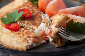 Egg pancake with cheese, red pepper and tomatoes