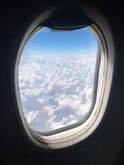 Puffy clouds outside the window