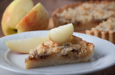 Piece of pie with apples and streusel