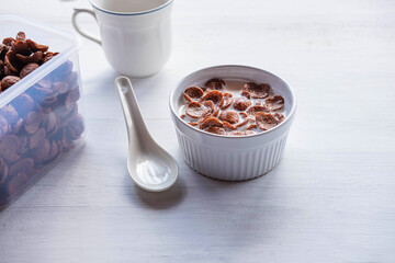 .Breakfast cereal with fresh milk on the white table