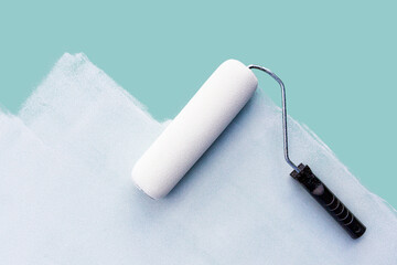paint roller on an unpainted surface. Real estate renovation concept