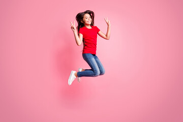 Fototapeta na wymiar Full body photo of cheerful kid girl jump make v-sign wear red casual style outfit isolated over pastel color background