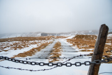 frozen landscape with a fence