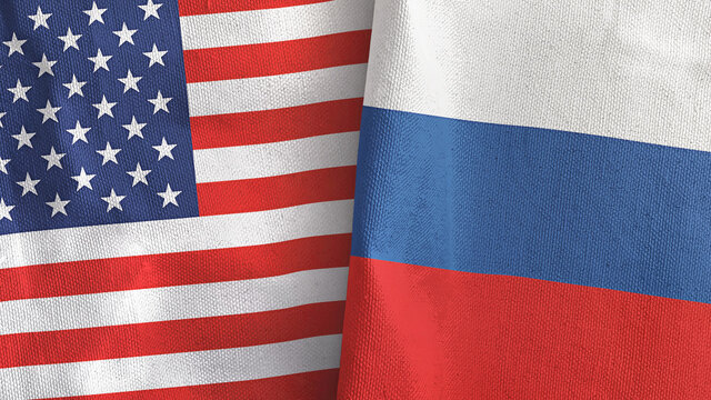 Russia and United States two flags textile cloth 3D rendering