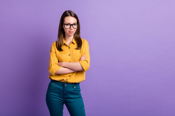 Photo portrait of confident girl wearing eyeglasses formal wear smiling folded hands isolated on vivid purple color background