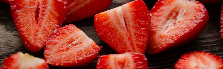 red raw fresh strawberries on wooden background, close view 