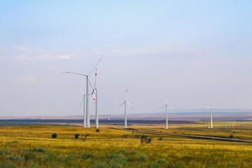 Fototapeta premium huge windmill generator turbines. Alternative energy.