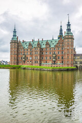 Naklejka premium Frederiksborg Castle (Frederiksborg Slot, XVII century) - palace in Hillerod, Denmark. Castle built as royal residence for King Christian IV of Denmark-Norway.