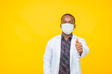 African male doctor wears a protective mask