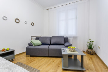 Fototapeta na wymiar Interior of the modern luxure bedroom in studio apartments in light color style