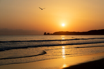 Sunrise over the "Deux Jumeaux" in Hendaye beach, Basque Country, France