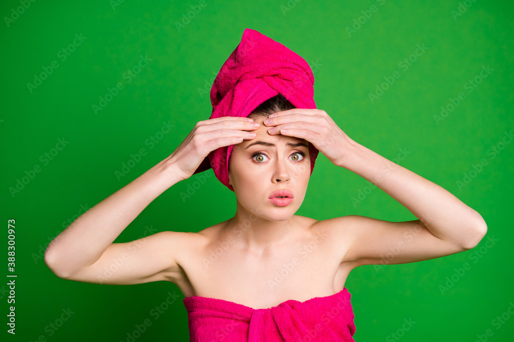 Poster close-up portrait of attractive worried lady wearing turban touching forehead pustule isolated on br