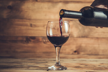pouring grape wine into a glass
