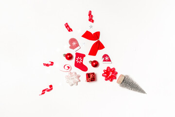 Winter design. Stocking, gifts, winter tree, ribbon and bow in Christmas composition on white background for greeting card. Decoration and copy space for your text.