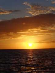 The stunning sunsets, beaches, coral reefs and huts on the Belize Islands in the Caribbean Sea