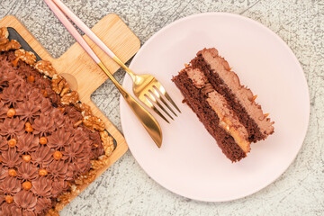 A piece of chocolate cake with a caramel layer. Top view.