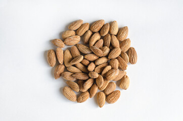salted almonds on white background