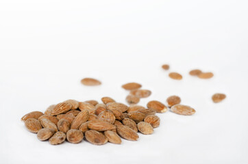 salted almonds on white background