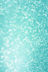 Blue glitter bokeh circle glow blurred and blur abstract. Glittering shimmer bright luxury . White and silver glisten twinkle for texture wallpaper and background backdrop.
